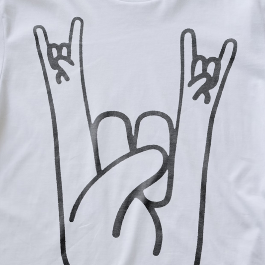 White electronic music T-shirt with a black line-art graphic of two hands making the rock on sign, shown in a close-up product shot.