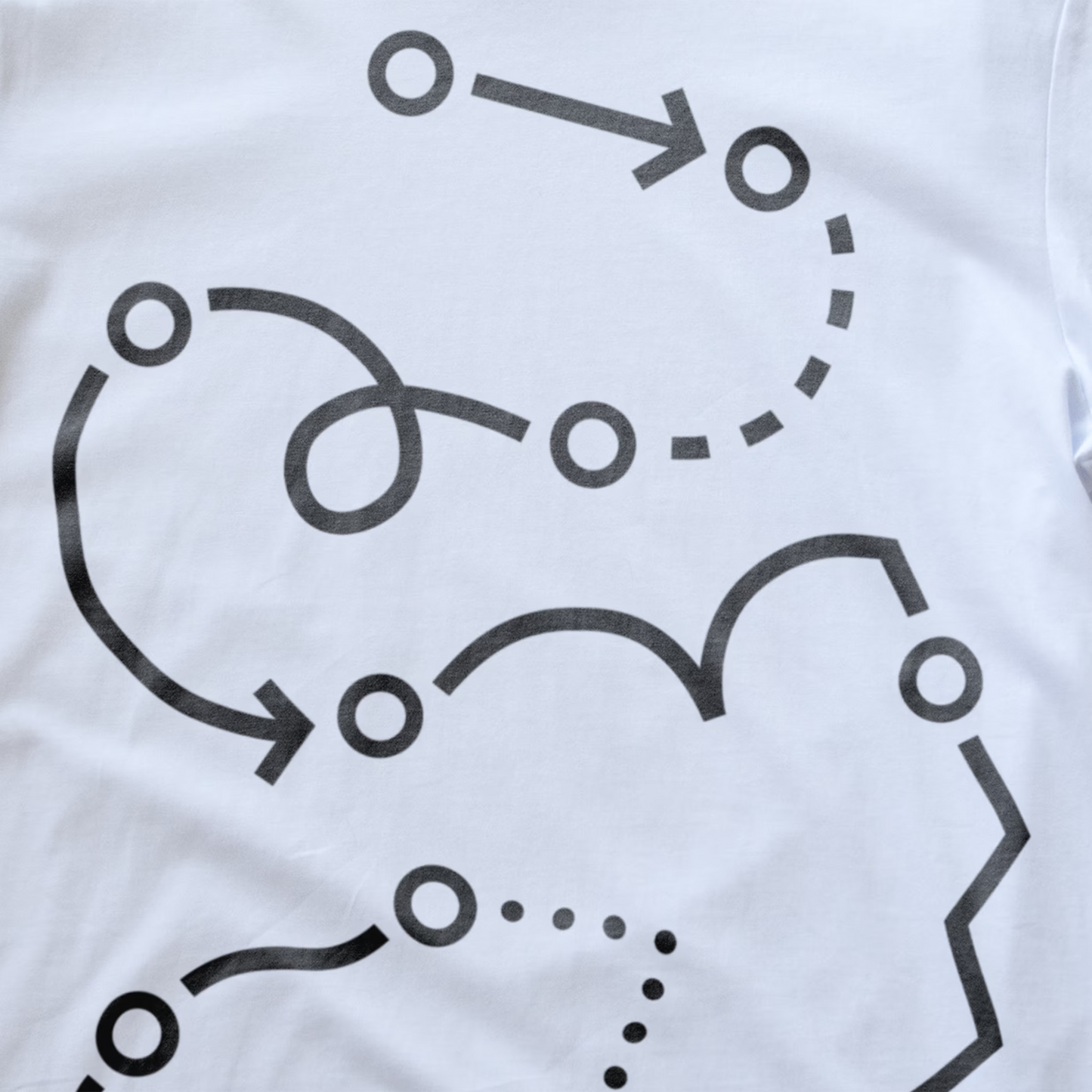 White fabric modular synth t-shirt with a black abstract line and dot graphic printed across it.