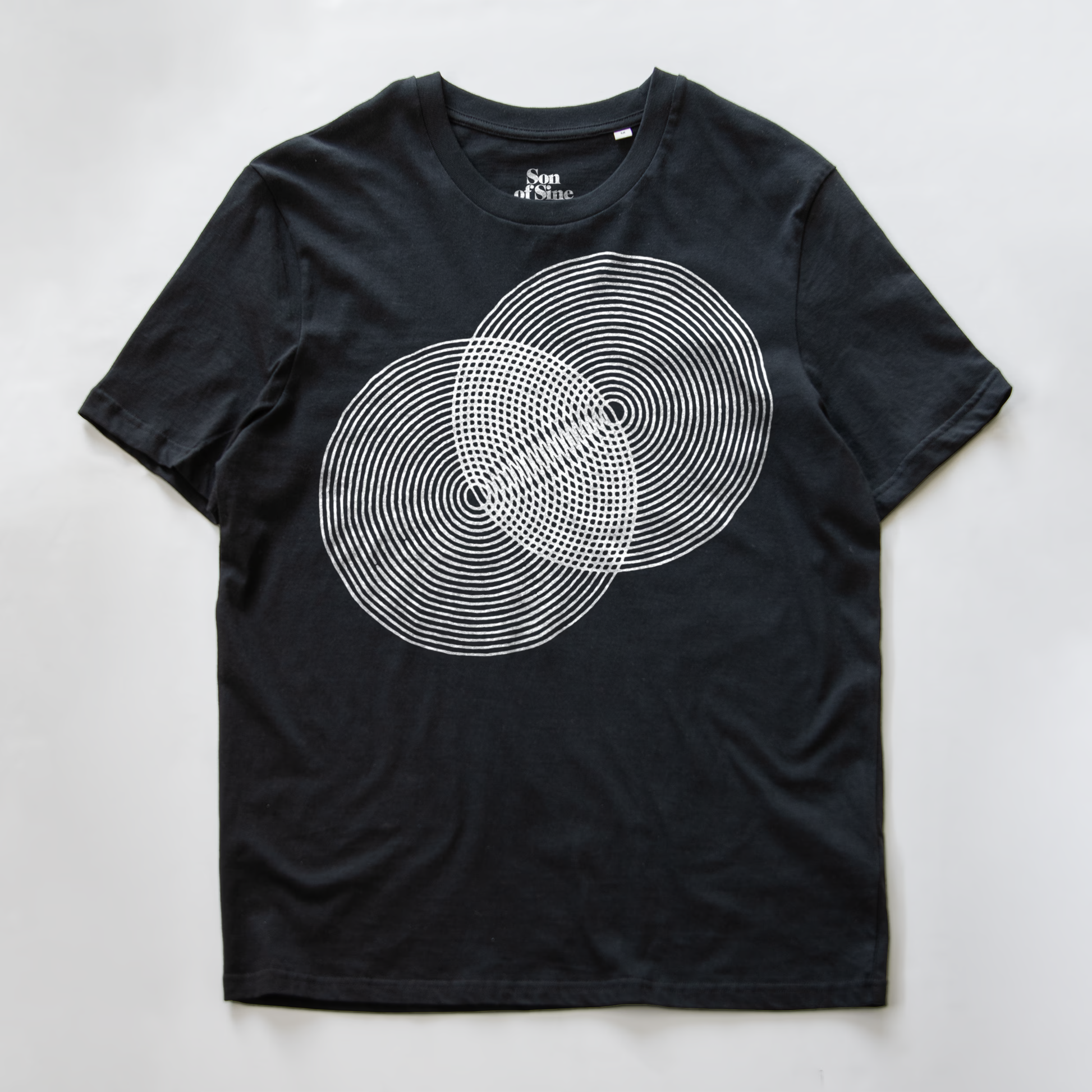 A black modular synth t-shirt with a white graphic of two overlapping circles made of concentric dotted and solid lines.