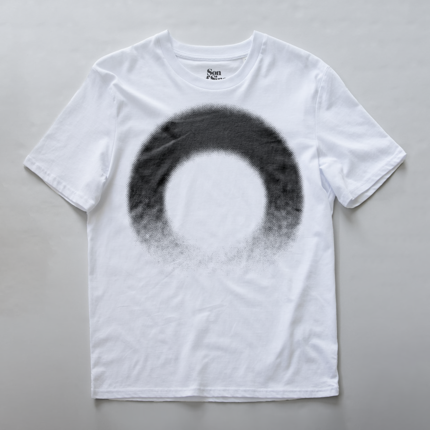 A white modular synth t-shirt with a large black circular ring graphic printed on the front.