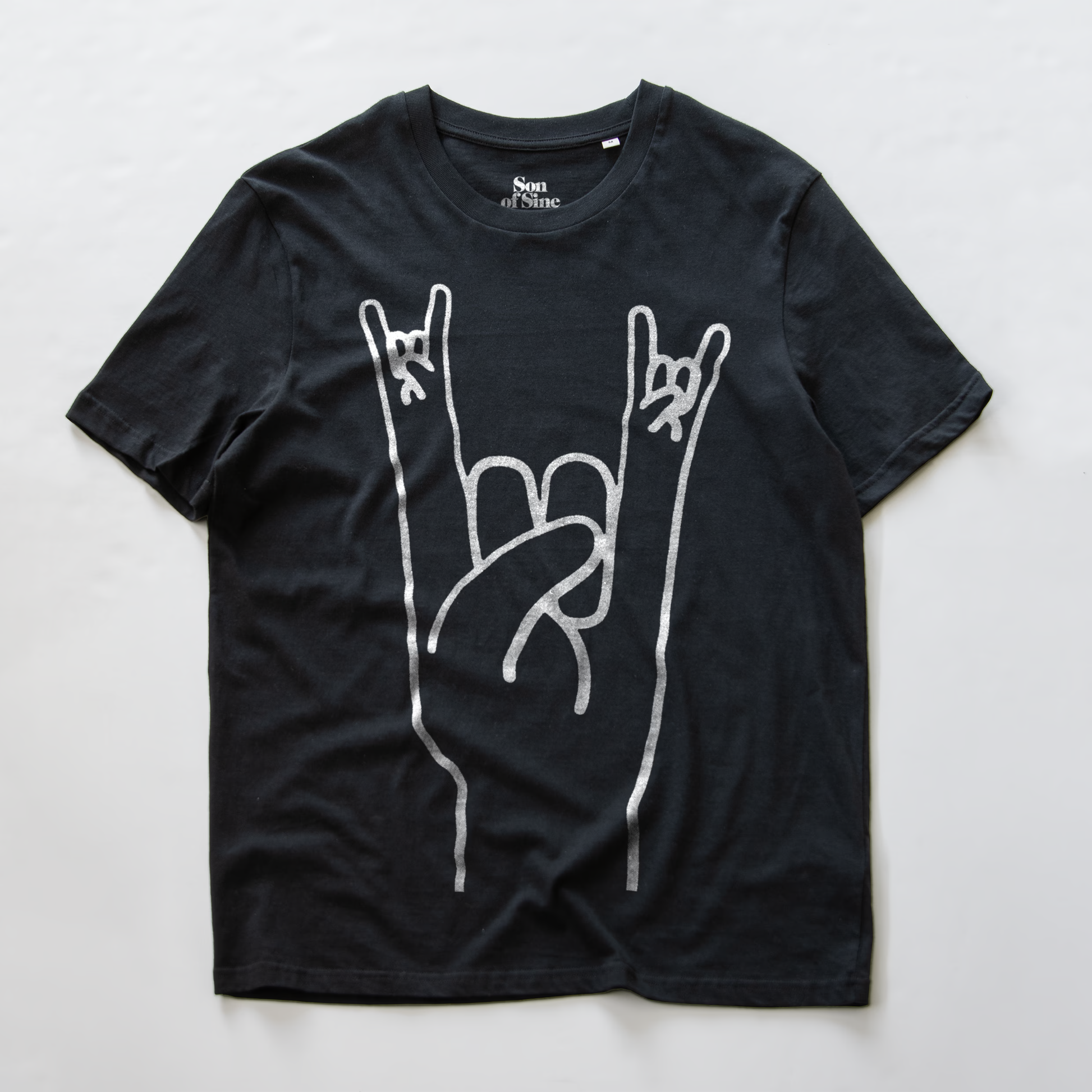 A black electronic music festival t-shirt with a white graphic of a hand making the rock on  sign.