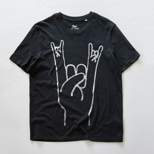 A black electronic music festival t-shirt with a white graphic of a hand making the rock on  sign.