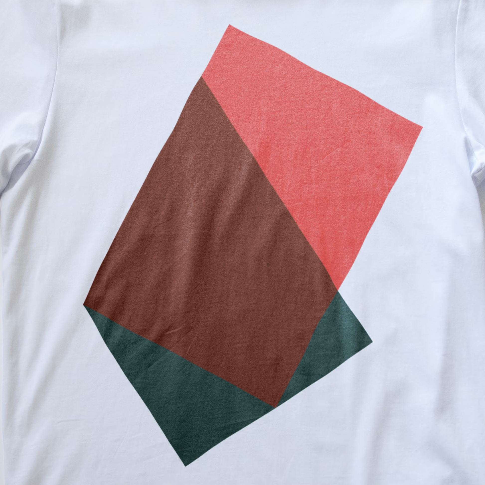 A close up of a synth inspired t-shirt featuring a large geometric graphic print on the front composed of overlapping colored rectangles.