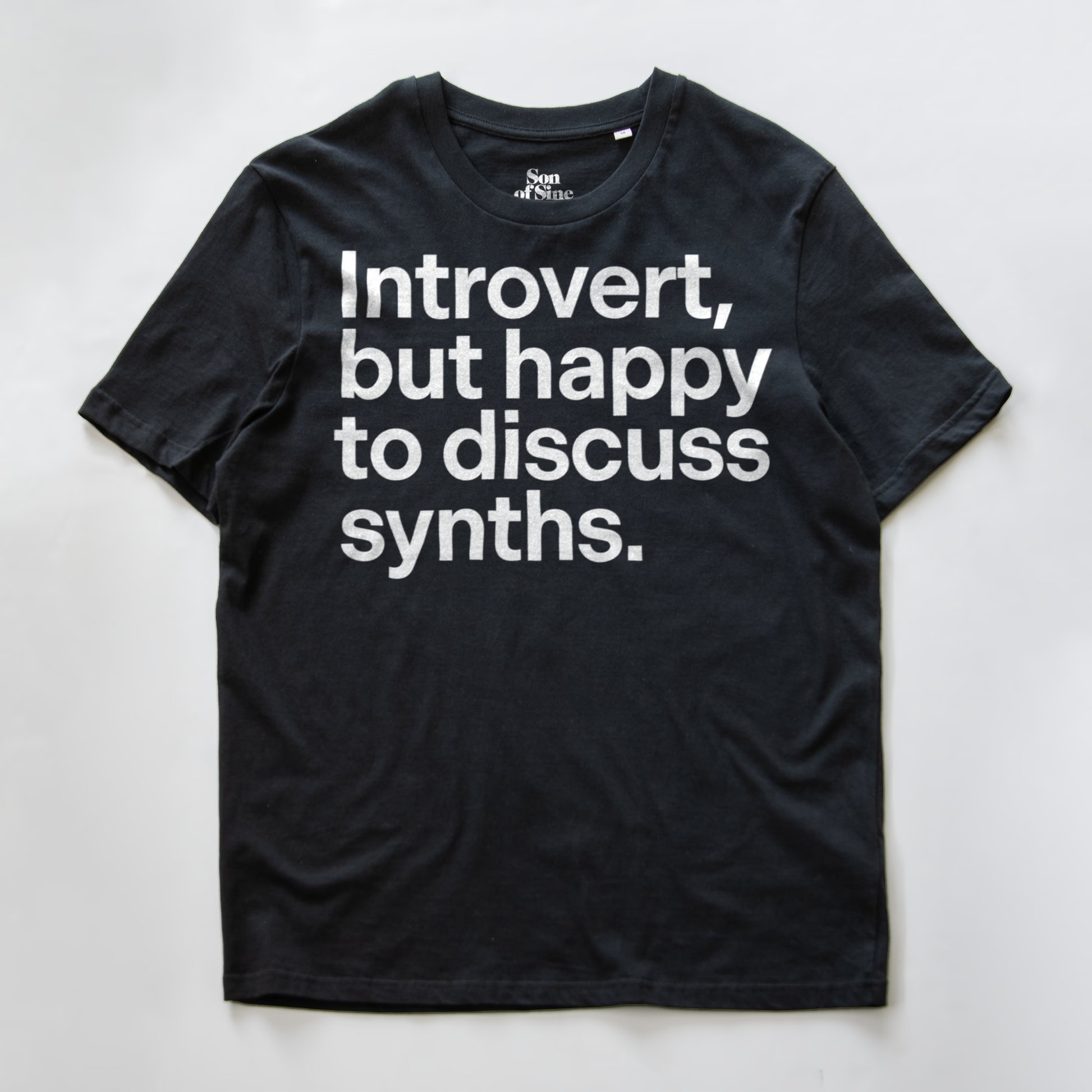 A funny synth inspired t-shirt with bold black text reading 'Introvert, but happy to discuss synths.' printed on the front.