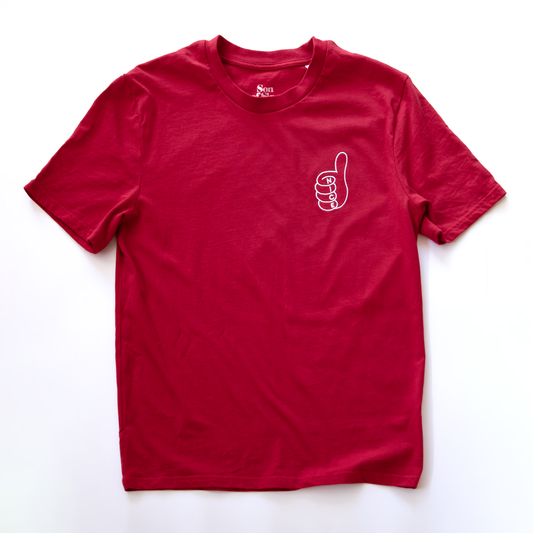 A red electronic music t-shirt with a small embroidered  line-art thumbs-up graphic on the left chest