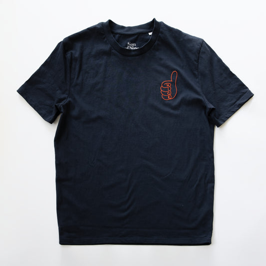 A dark navy blue electronic music t-shirt with a small orange outline graphic of a thumbs-up hand on the left chest.