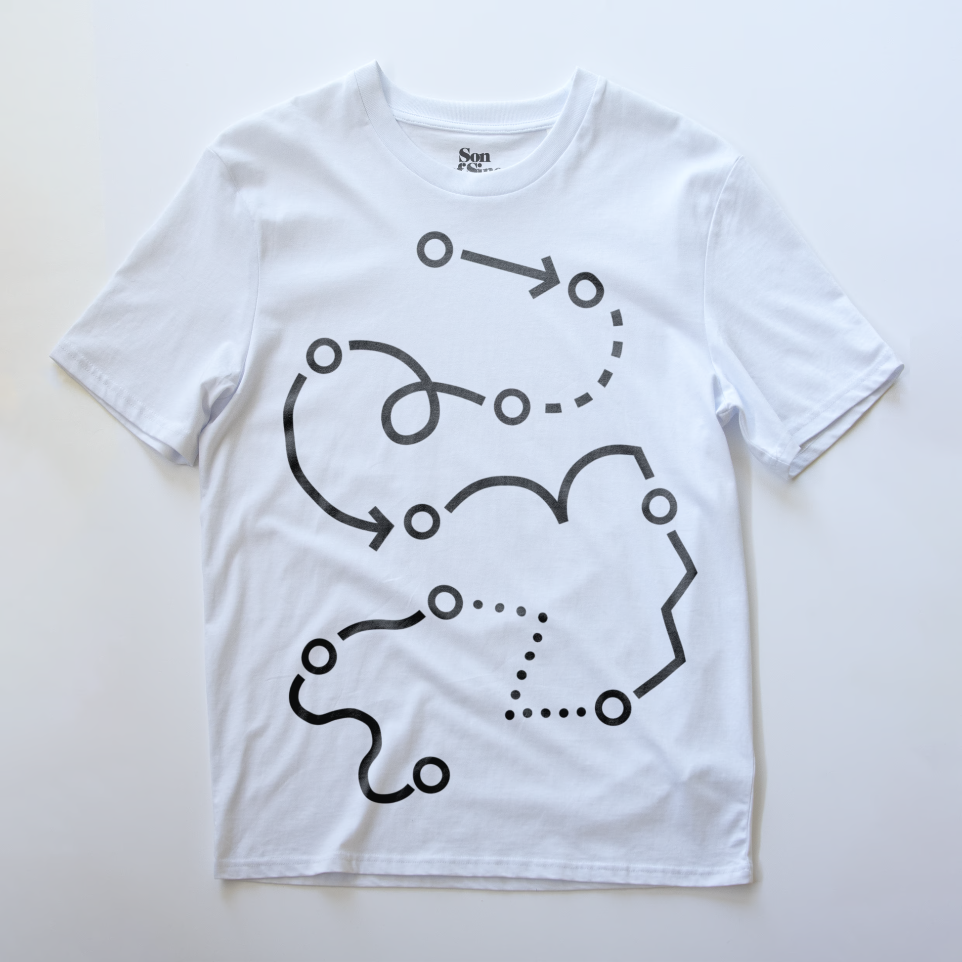 A white modular synth t-shirt with a black graphic print of abstract winding lines and dots, laid flat on a light background. 