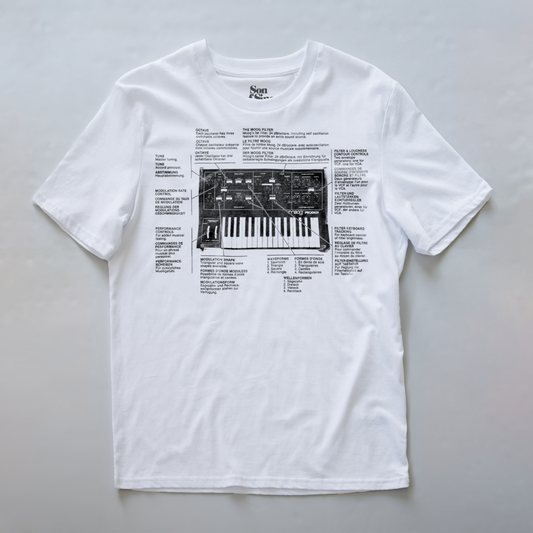 A white synth t-shirt featuring a black graphic print of a Prodigy synthesizer with technical specifications and labels.