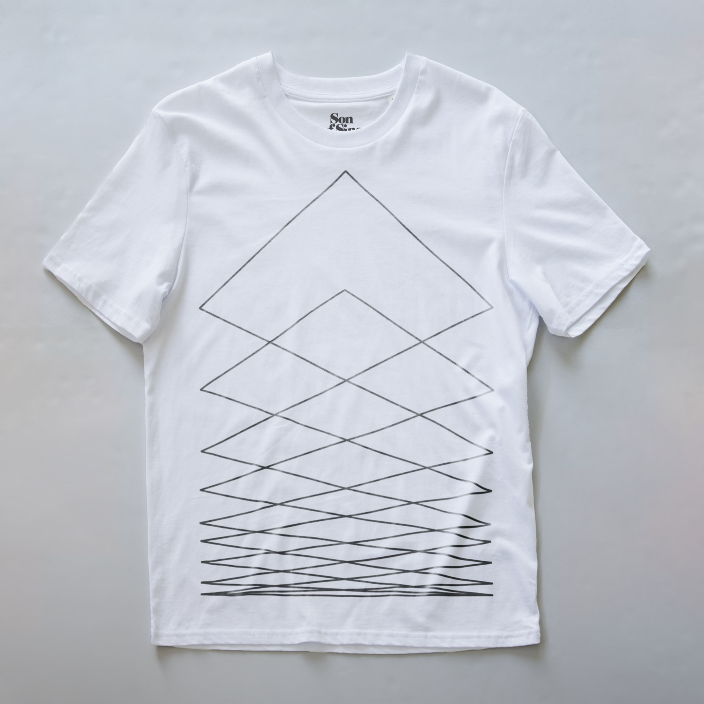 A white synth t-shirt with a black geometric line pattern. The brand name 'Son Of Sine' is visible on the inner neck label.