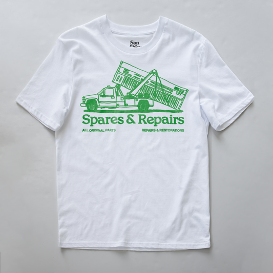 A synth inspired t-shirt with a green graphic of a tow truck carrying a synth and the text 'Spares & Repairs' printed on the front.