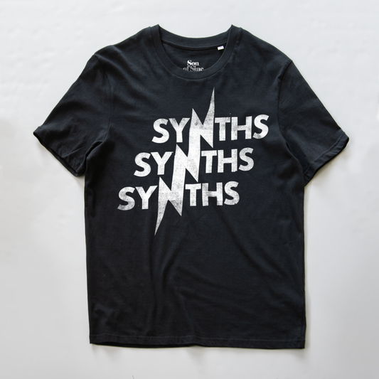 A black synth t-shirt with a distressed white graphic print reading 'SYNTHS' three times vertically, overlaid with a white lightning bolt running across the words.