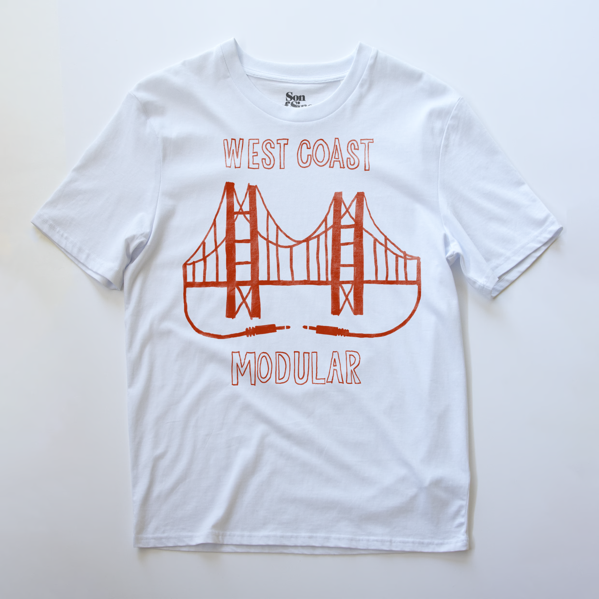A white synth t-shirt, featuring an illustration of the Golden Gate Bridge with the text 'WEST COAST MODULAR' printed in red.